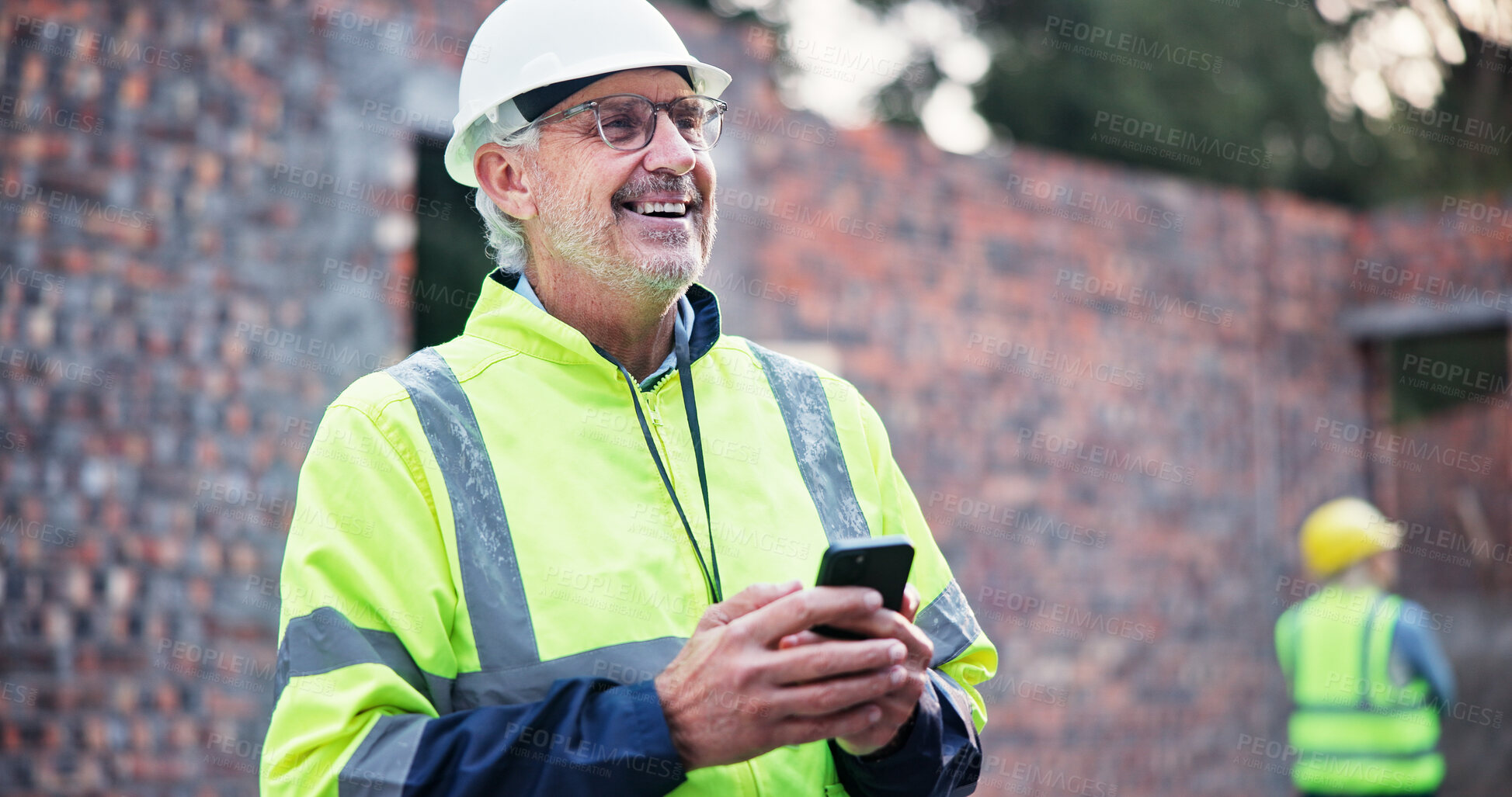 Buy stock photo Phone, mature man and construction worker on site with contact for renovation approval. Contractor, industry and male civil engineer reading building, maintenance or repairs plan on cellphone.