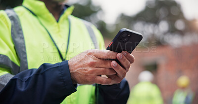 Buy stock photo Phone, man and hands of construction worker on site with contact for renovation approval. Contractor, cellphone and closeup of male civil engineer reading building, maintenance or repairs online.