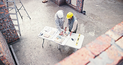 Buy stock photo Above, discussion and people on construction site for blueprint, inspection or collaboration at table. Contractor, meeting and men with floor plan, brainstorming or architect design in morning