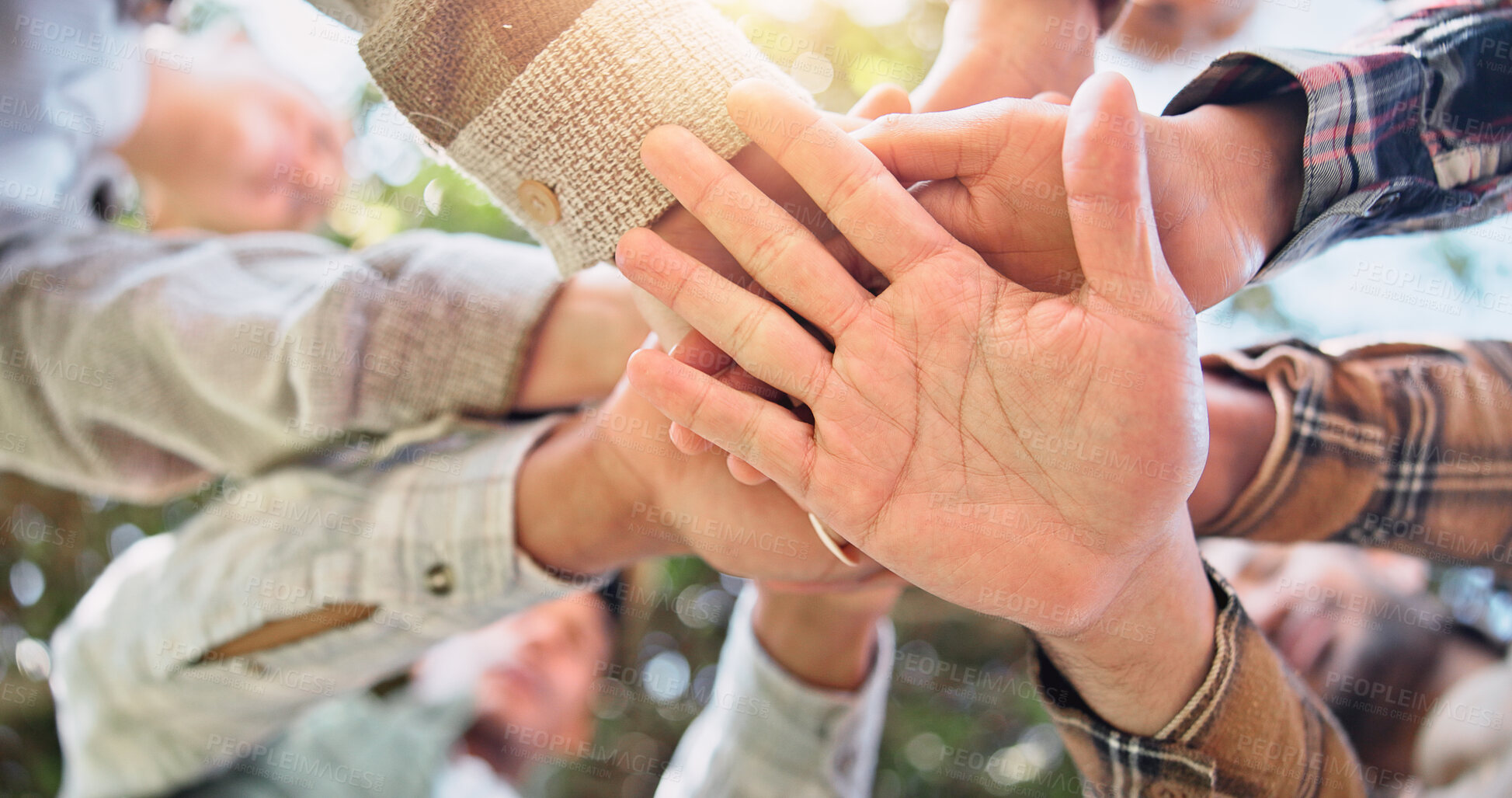 Buy stock photo Below, hands together and outdoor with people, stack and support with team building. Low angle, group and friends with vacation, hiking and cooperation with motivation for journey, nature and palm