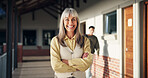 Smile, woman and portrait of teacher at school for career in education, confidence and happiness. Professional, job and mature female educator with knowledge for teaching in hallway at campus academy