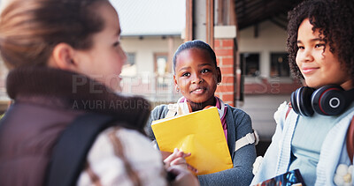 Buy stock photo Children, friends and talking at school, corridor and happy at break, listen and bonding with education. Kids, girl and group for discussion, smile or books for scholarship, learning and development