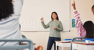 Buy stock photo Teacher, children and raised hand in classroom, back and scholarship with answer, quiz and development at school. Woman, board and math for solution, question and education with learning at academy