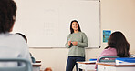 Education, teacher and math lesson in classroom for multiplication, sum calculation or learning support. People, students and educator by whiteboard for teaching equation, problem solving or solution