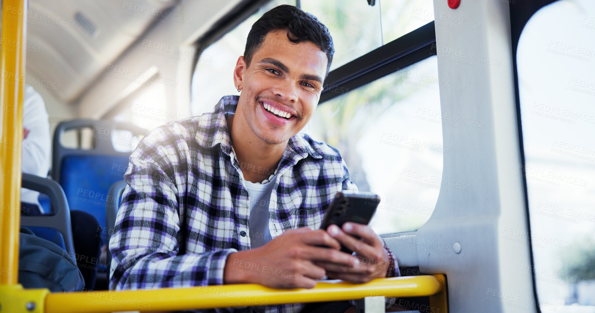 Buy stock photo Happy man, portrait or student with phone on bus for public transport, travel app or local commute in city. Male person, smile and tourism with mobile smartphone for road trip, journey or destination