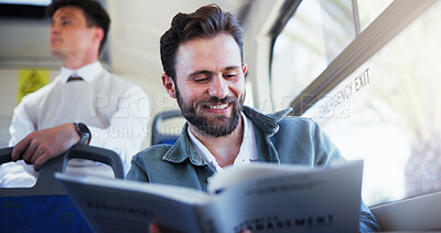 Buy stock photo Happy man, bus and reading with book in public transport for story, novel or knowledge in city. Male person, tourist or traveler with smile or literature for tour guide, local commute or trip in town