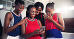 Team, sports and girls with mobile, fitness and watching game on social media, laughing or browsing. Basketball, player and black people with smartphone for videos, break or website for entertainment