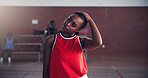 Basketball, fitness and woman with stretching on court for match preparation, tournament workout and practice. Sport, player and neck warm up for game performance and getting ready for competition