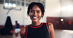 Portrait, smile and black woman at basketball court for training, sports or practice for workout. Player, happy athlete and female person in gym for fitness, competition and wellness with confidence