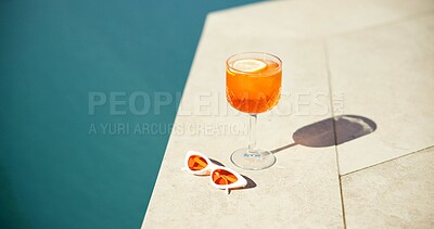 Buy stock photo Cocktail, summer and swimming pool with sunglasses and drink for holiday getaway or vacation. Travel, resort and alcohol by water for outdoor luxury, hotel hospitality and shades to relax or chill