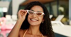 Smile, sunglasses and portrait of woman at pool for spring break, vacation or hotel. Happiness, relax and holiday trip with person at villa for hospitality, festival and luxury accommodation