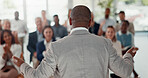 Presentation, office and back of speaker with business people for conference, training or meeting. Corporate manager, discussion and workers in workshop, convention and seminar for financial planning