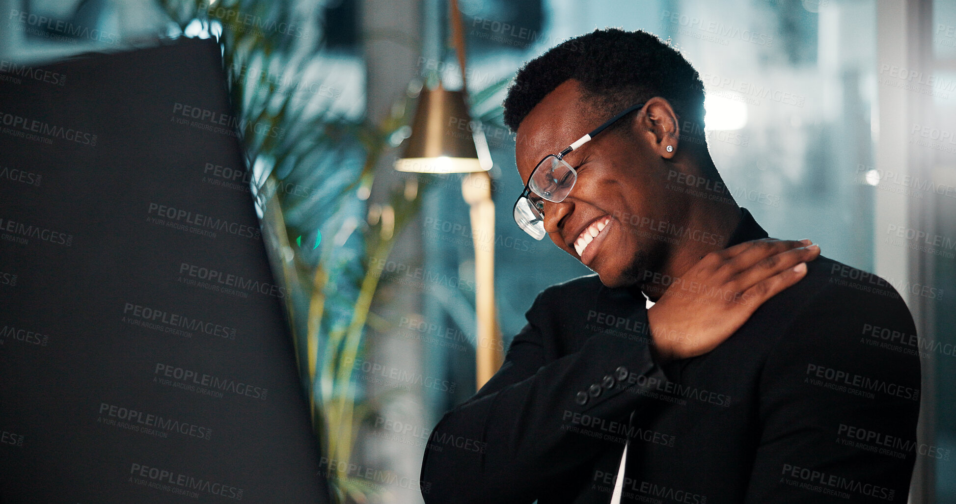 Buy stock photo Black man, neck pain and stress at night for overtime, burnout and muscle tension from bad posture in office. African employee, stretches and tired with joint injury, pressure or deadline for project