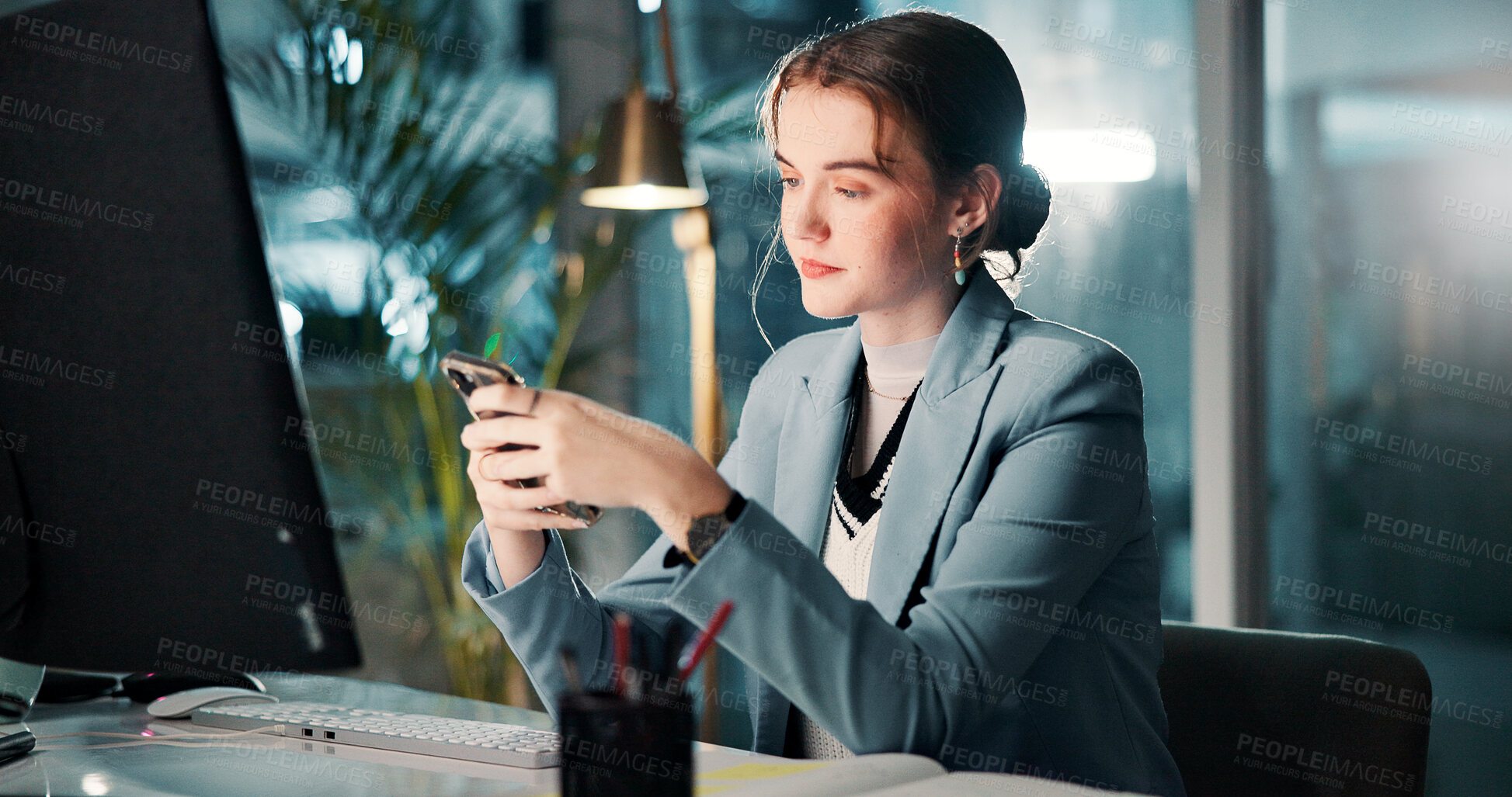 Buy stock photo Night, texting and woman with smartphone, office or communication with tech at work and workaholic. Business, account manager or person with mobile for late message, typing or chat for project on app