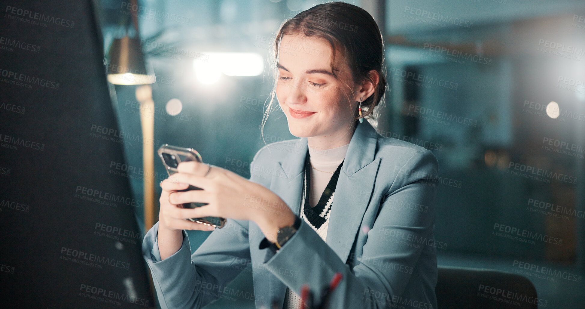 Buy stock photo Night, smile and woman with smartphone, office and communication with tech at work and workaholic. Business, account manager and person with mobile for message, texting and chat for project on app