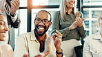 Man, applause and smile at meeting in office with team, goals and support with celebration at startup. Business people, cheers and success with achievement, profit and excited at creative agency