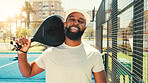 Happy man, portrait and paddle tennis with racket for sport, game or match on outdoor court. Face, male person or athletic player with smile, hat or bat for friendly competition, challenge or fitness