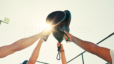 Buy stock photo Hands, padel and high five with team for sports, training success and motivation in low angle with flare. Outdoor, athlete group and people in celebration for winning tennis game and achievement