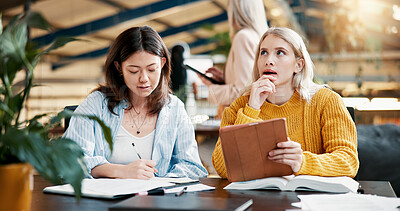 Buy stock photo Classroom, students and women with tablet, planning and discussion for assignment, online and thinking. University, teamwork and studying with tech for exam, knowledge and people with scholarship