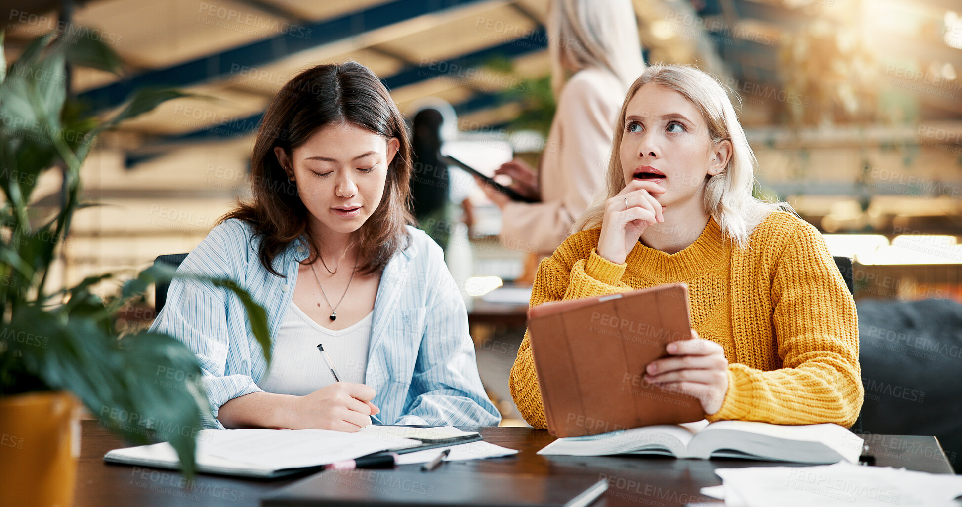 Buy stock photo Classroom, students and women with tablet, planning and discussion for assignment, online and thinking. University, teamwork and studying with tech for exam, knowledge and people with scholarship
