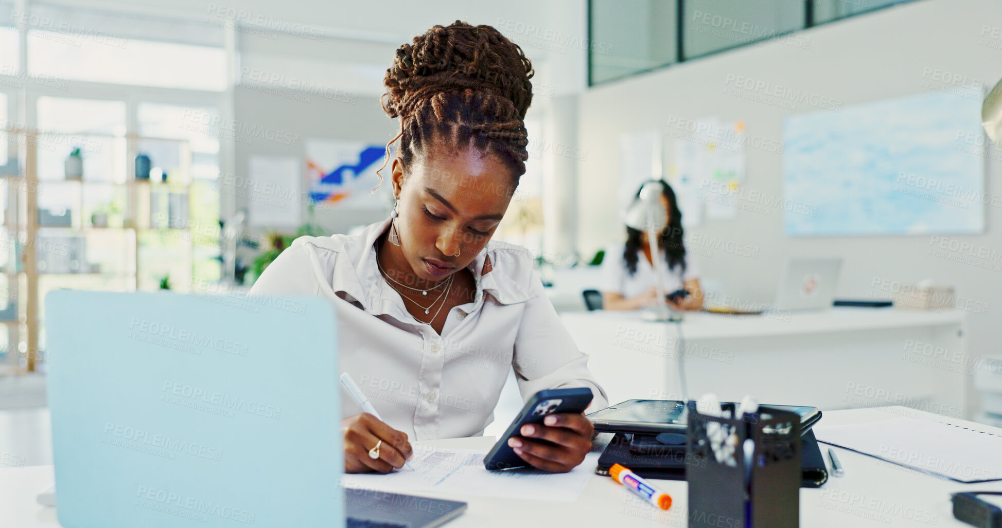 Buy stock photo Business woman, writing and phone in office for schedule, agenda and administration at desk. Journalist employee, person and paperwork with technology for research, planning and creative proposal