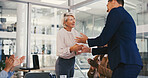 Shaking hands, meeting and business people in office with company deal, contract or merger. Negotiation, corporate partnership and female manager with employee for thank you handshake in workplace.