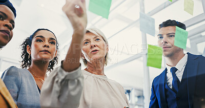 Buy stock photo Glass wall, management and writing with business people in office for planning or strategy. Brainstorming, coaching and sticky notes with employee team in low angle for collaboration or discussion