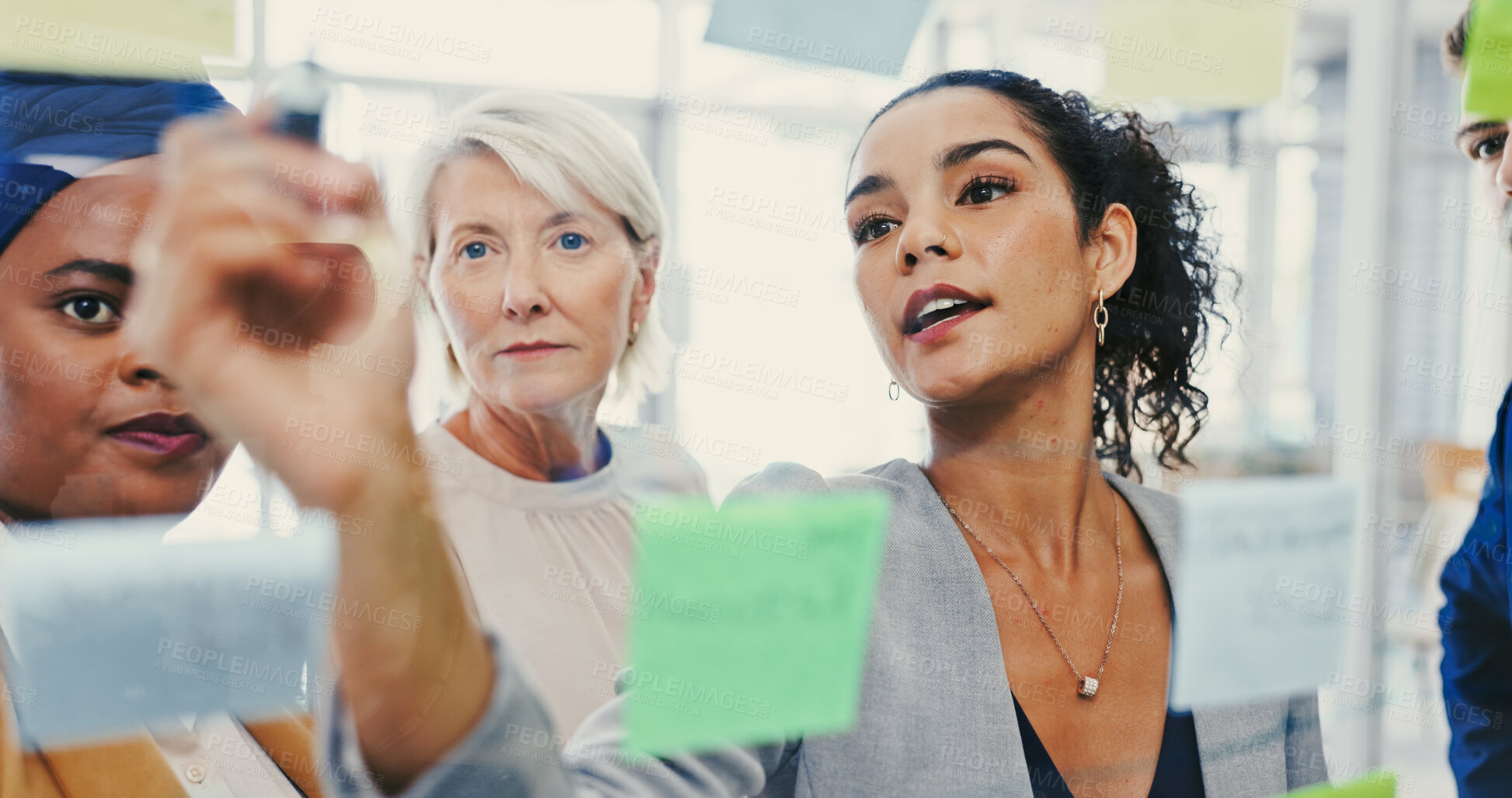 Buy stock photo Agenda, glass wall and writing with business people in office for planning or strategy. Brainstorming, collaboration and sticky notes with employee group in workplace for discussion or management