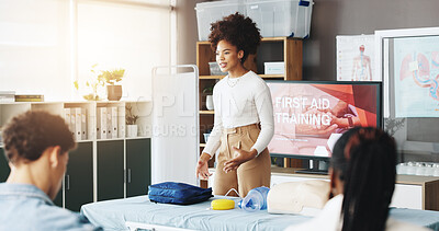 Buy stock photo Woman, talk and teaching for first aid training with demonstration, medical course and rescue. Person, explain and presentation for safety lesson, healthcare class and learning for emergency service