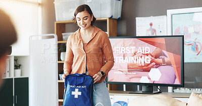 Buy stock photo Woman, teaching and bag for first aid course for rescue safety, demonstration lesson and advice. Person, explaining and medical kit for emergency risk, learning procedure and process for life saving