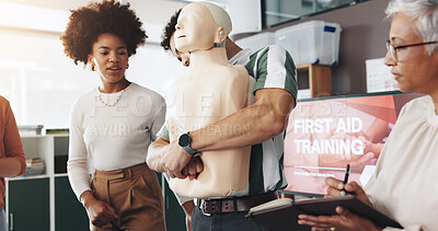 Buy stock photo First aid, training and people with choking dummy for CPR, abdominal thrusts and life saving procedure in office. Simulation, presentation and demonstration for employee rescue and workplace safety