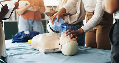 Buy stock photo Group, cpr and woman with mask, dummy and lesson to help in emergency, training and demonstration. Course, people and instructor with ventilator for mannequin, teaching and healthcare in class