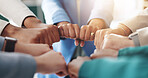 Hands, business people and fist bump in circle for teamwork, support and group cooperation. Huddle, collaboration and community of employees closeup for motivation, synergy and solidarity in office