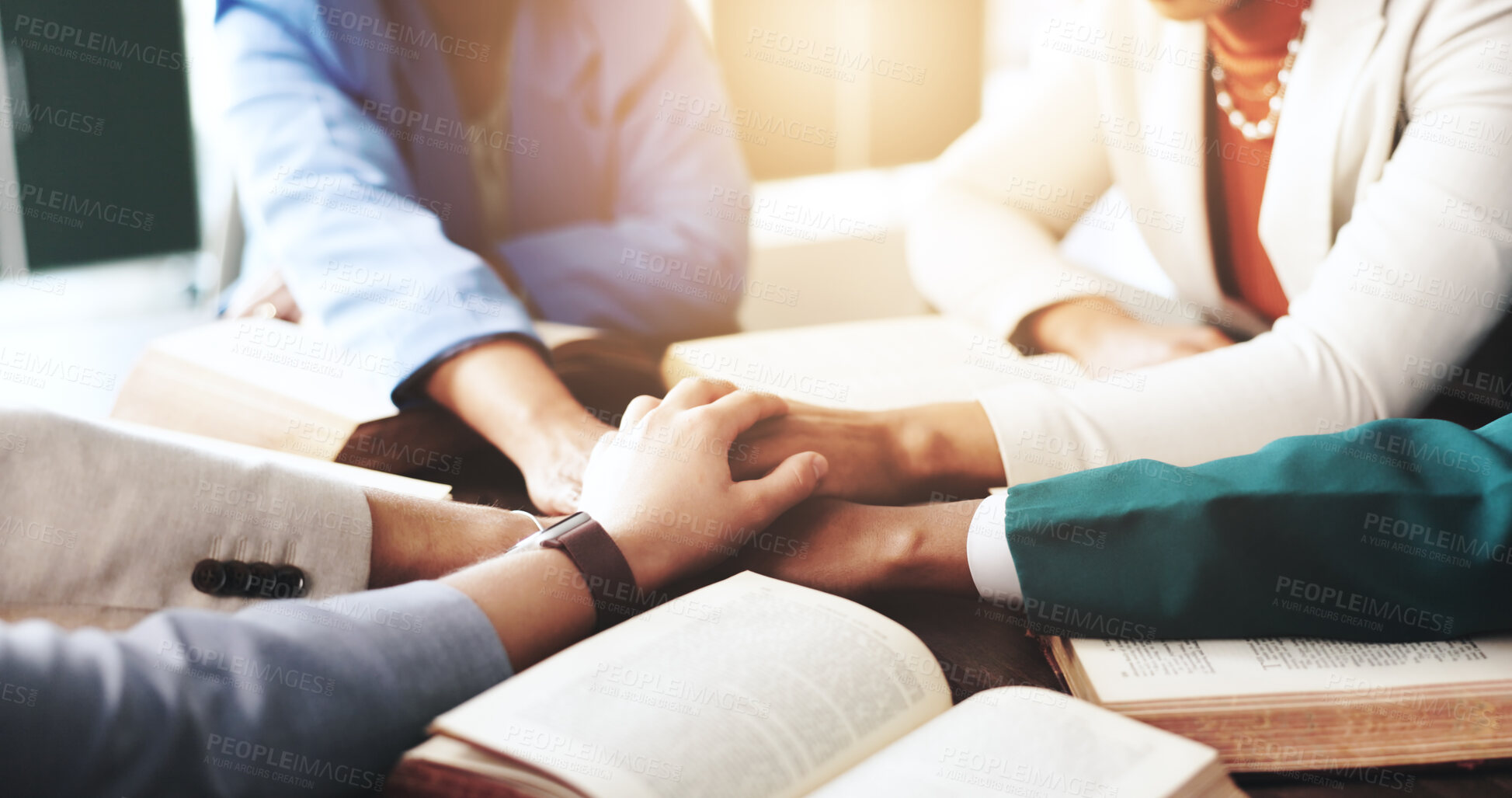 Buy stock photo Bible study, religion and group of people holding hands for community, support and praying. Spiritual, Christianity and men and women together for guidance, learning scripture and prayer for belief