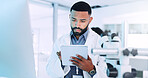 Man, scientist and reading on tablet in lab for medical research, experiment results and study report. Male person, digital app and information of investigation feedback, discovery update and vaccine