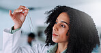 Woman, liquid and scientist with test tube in laboratory for chemical experiment, research or project. Pharmaceutical, science and female biologist with glass vial with solvent for medical innovation