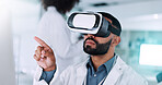 Research, scientist and man with vr headset, lab and tech to simulate surgical procedure and online. Innovation, medical professional and person with software for diagnosis, futuristic and pointing