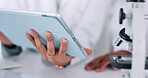Scientist, hands and research with tablet, microscope and lab for review, results and solution for pharmaceutical study. People, partner and digital touchscreen on app for medical trial with team