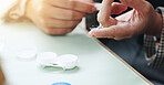 Optometry, contact lens and finger of person for eye care, health and wellness with container. Healthcare, closeup and hands with eyewear for vision, eyesight and prescription for ophthalmology