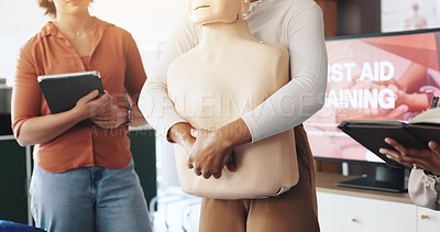Buy stock photo First aid, training and hands with choking dummy for CPR, abdominal thrusts and life saving procedure in office. Business, people and healthcare presentation for employee rescue and workplace safety
