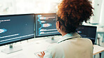 Programmer, woman and computer screen with typing in office for writing code, app development and debugging. Back, programming and employee with data analytics for software testing and system update