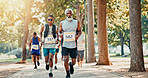 Running, marathon and race with people in park for charity event, health challenge and fitness. Training, fundraising competition and exercise with group of runners in nature for workout and sports