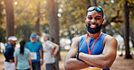 Portrait, athlete and man with arms crossed, outdoor and smile for win of competition and confident. Sports, runner and person with medal for race, champion and happy for marathon in nature or winner