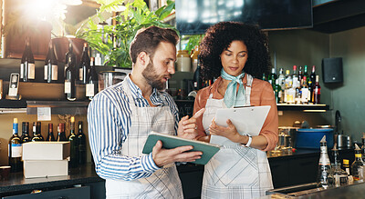 Buy stock photo Online, entrepreneur and team with tablet, cafe and review of order for inventory, people or discussion. Small business, woman and man with tech for sales, clipboard or colleagues with app in startup