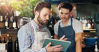 Buy stock photo Men, barista and tablet with discussion at cafe with sales report, coach and review schedule at diner. People, mentor and digital touchscreen with app for inventory, menu and training at coffee shop