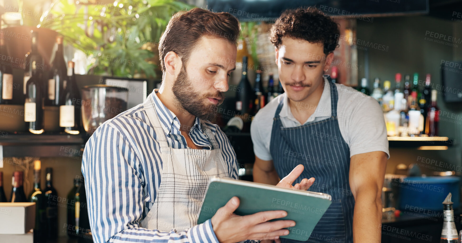 Buy stock photo Men, barista and tablet with discussion at cafe with sales report, coach and review schedule at diner. People, mentor and digital touchscreen with app for inventory, menu and training at coffee shop
