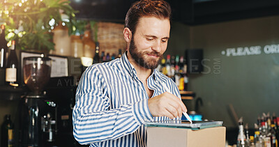 Buy stock photo Coffee shop, pen and man on tablet with boxes in cafe for menu items, inventory and online order. Restaurant, hospitality and business owner on digital tech for internet, pub planning and checklist