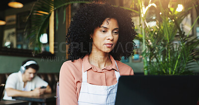 Buy stock photo Woman, laptop or reading in restaurant for small business, finance management or online payment. Cafe owner, technology or connectivity for admin with stock order, supplier contact or employee shifts