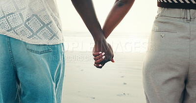 Buy stock photo Couple, holding hands and love on beach outdoor for summer vacation, romantic date and bonding. People, closeup and travel for tropical holiday, partner affection and relationship commitment at ocean