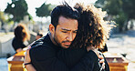 Hug, sad and funeral with people, graveyard and grief with emotion, mental health or sorrow. Ceremony, outdoor or family with loss, support or comfort with compassion, mourning or empathy with burial